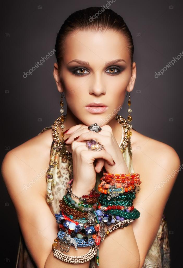 Beautiful woman in bracelets Stock Photo by ©zastavkin 25905695
