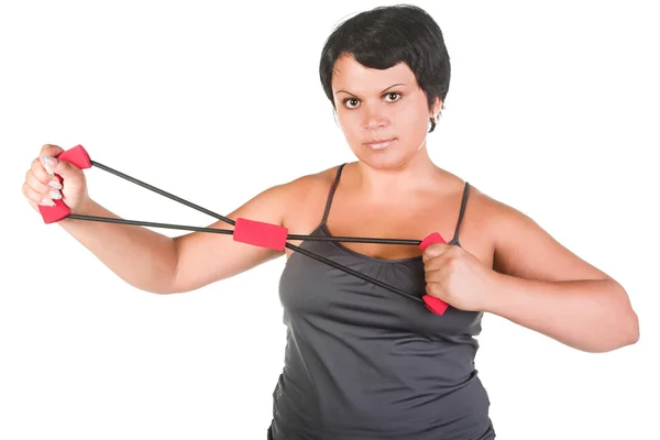 Fat woman with chest expander — Stock Photo, Image