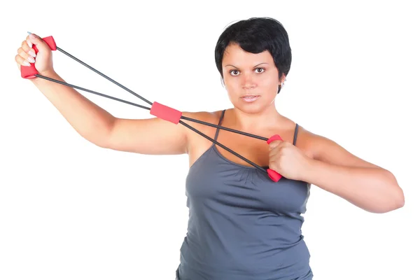 Fat woman with chest expander — Stock Photo, Image