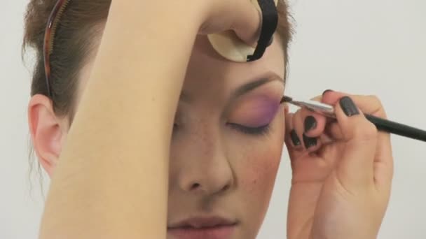 Beauty woman having her made up by stylist — Stock Video