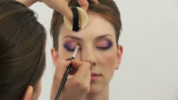 Beauty woman having her made up by stylist — Stock Video