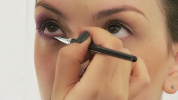 Woman having her face made up — Stock Video