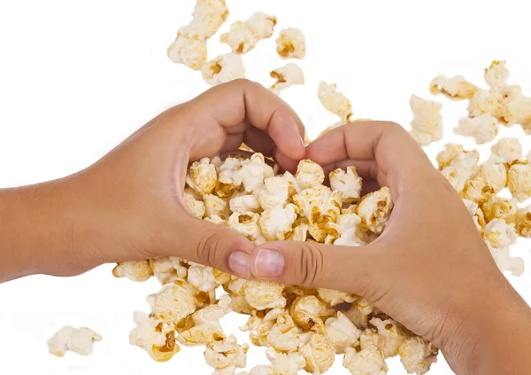 Popcorn w ręku na białym tle — Zdjęcie stockowe