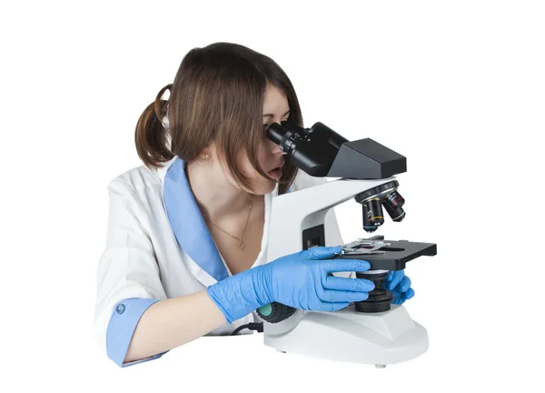 Chica con microscopio —  Fotos de Stock