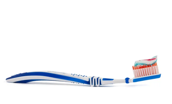 Pasta de dientes con cepillo de dientes aislado — Foto de Stock