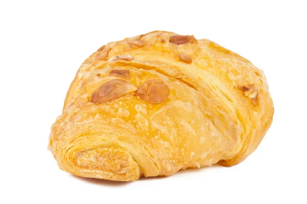 Croissant mit Nüssen isoliert — Stockfoto