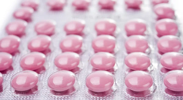 Roze tabletten close-up — Stockfoto