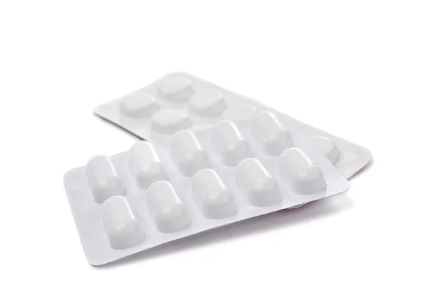 Упаковки таблеток изолированы — стоковое фото