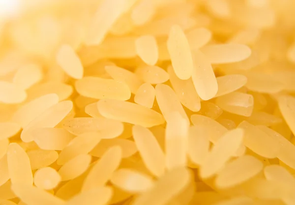 Pile of long grain brown rice close-up — Stock Photo, Image