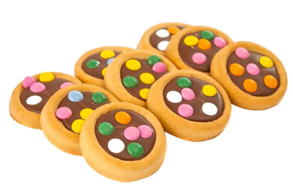 Biscuits au chocolat avec des saupoudres colorées — Photo