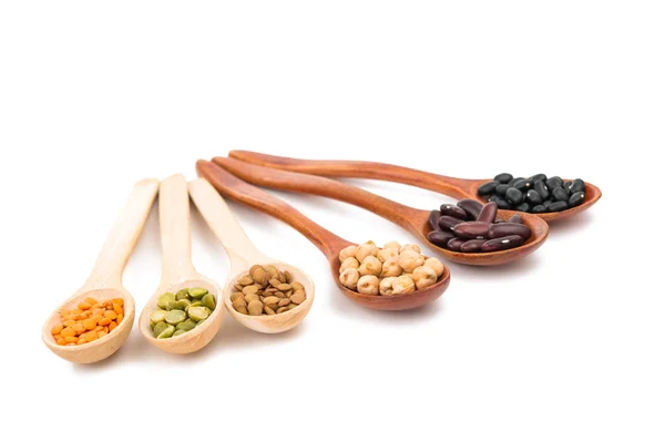 Pulses in a wooden spoon isolated — Stock Photo, Image