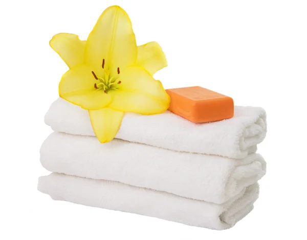 Towel with lily flowers isolated — Stock Photo, Image