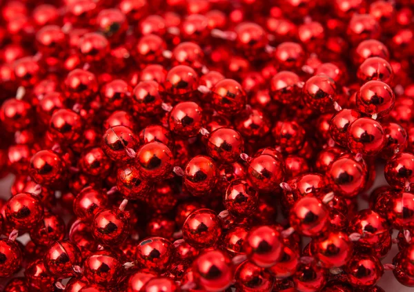 Christmas garland made from small red beads. — Stock Photo, Image