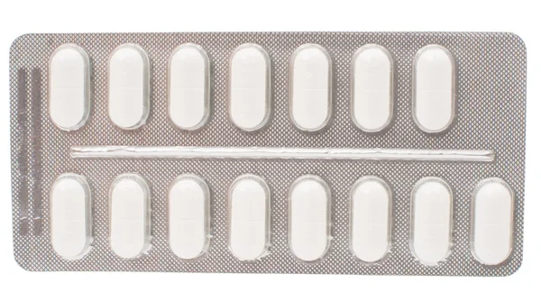 Pakning med tabletter isolert – stockfoto