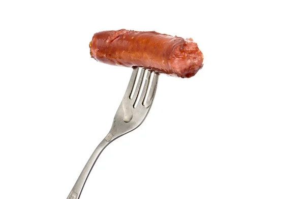 Fried sausage on a fork — Stock Photo, Image