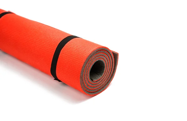 Esterilla de yoga roja agradable para hacer ejercicio en casa o gimnasio — Foto de Stock