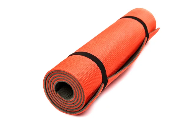 Esterilla de yoga roja agradable para hacer ejercicio en casa o gimnasio — Foto de Stock