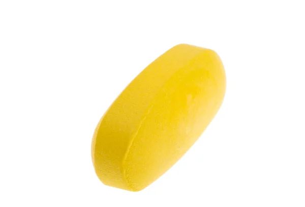 白い背景上に分離されて黄色い錠剤 — ストック写真