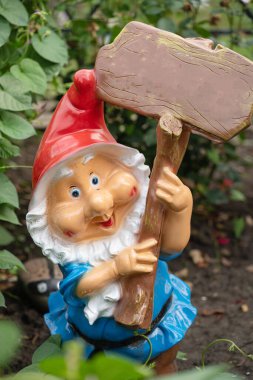 garden gnome in the flower bed macro