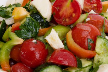 salad with tomatoes and mozzarella cheese isolated on white background