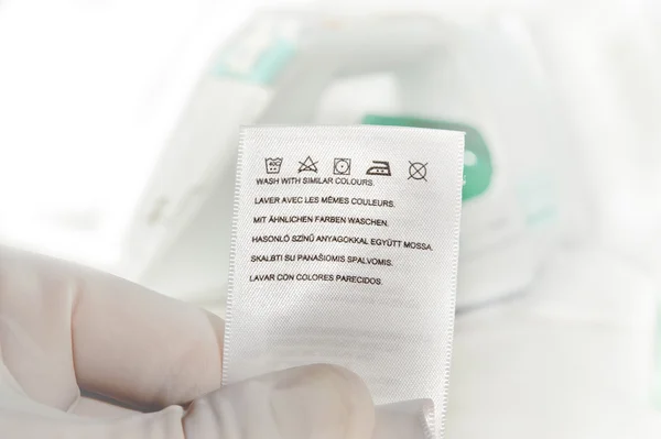 Laundry advice clothing tag. — Stock Photo, Image