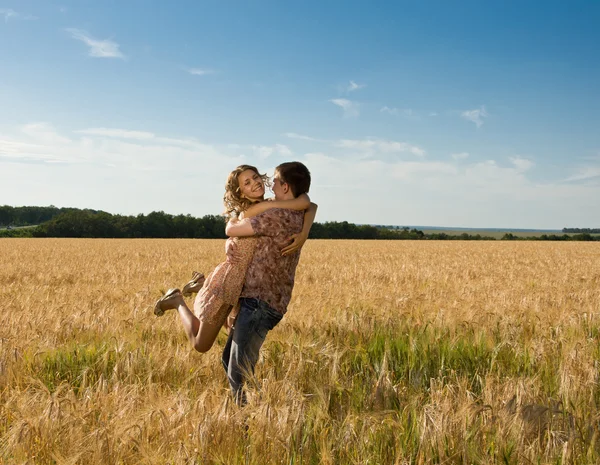 Loving happy couple on field — Stock Photo, Image