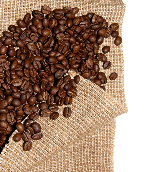 Coffee beans on burlap — Stock Photo, Image