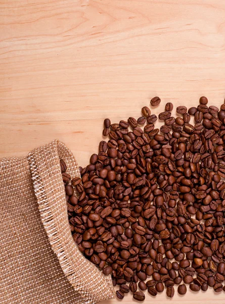 Coffee beans and burlap — Stock Photo, Image