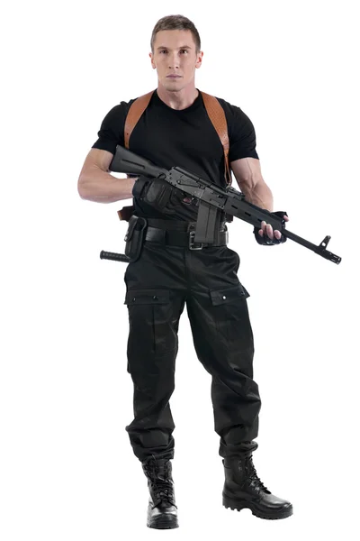 Police officer is holding Kalashnikov — Stock Photo, Image