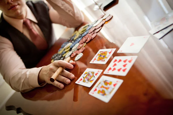 Serious gentleman open his cards in poker — Stock Photo, Image