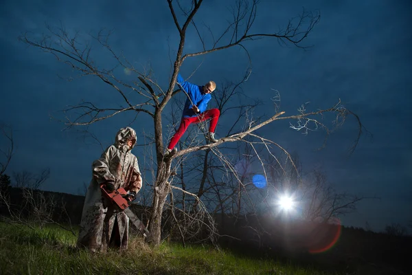 Maniac with the chainsaw — Stock Photo, Image