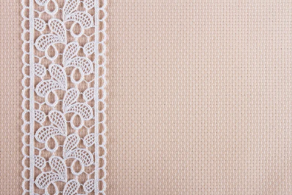 Fabrics for embroidery a cross, lace and ribbons — Stock Photo, Image
