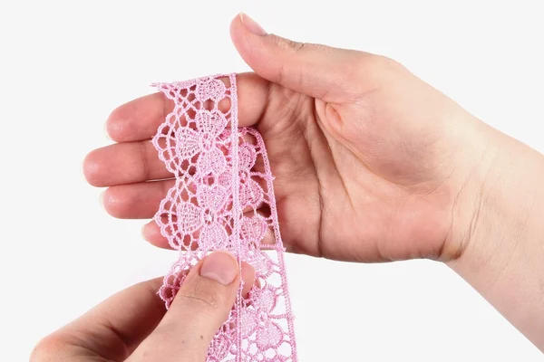 Hand holding the lace on a white background — Stock Photo, Image