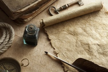 Antique paper scroll , quill pen and compass clipart