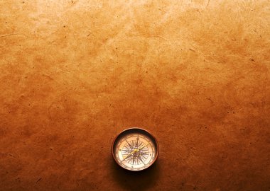 Compass on paper background
