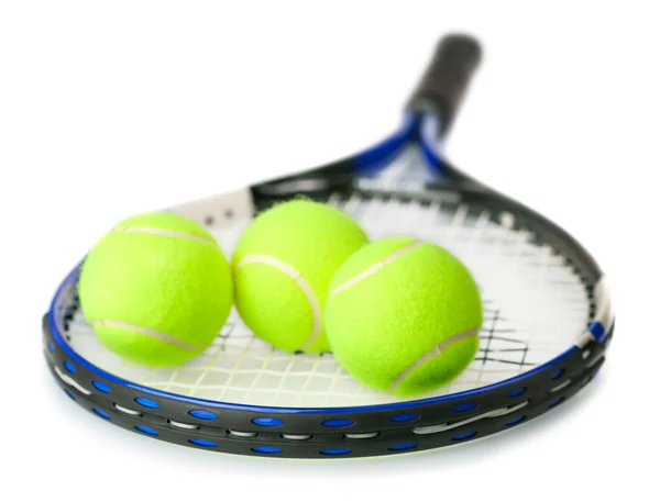 Tennis racquet with yellow tennis balls — Stock Photo, Image