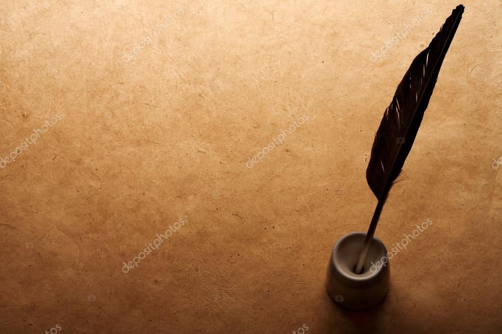 Inkwell and quill on vintage paper background — Stock Photo © Alexstar