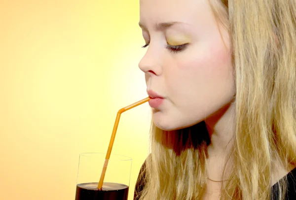 Girl drinks from a glass — Stock Photo, Image