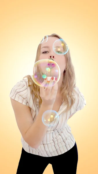 Girl playing with lots of soap bubbles — Stock Photo, Image