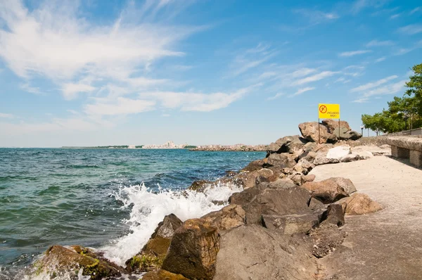 Beach warning sign of Unguarded Beach — Stock Photo, Image