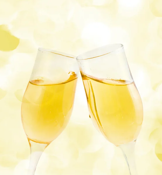 Two glasses of champagne with lights in the background — Stock Photo, Image