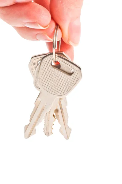 Main humaine avec des clés sur blanc — Photo