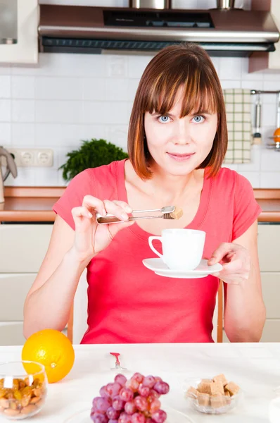 Young happy woman with lot of sugar — Stock Photo, Image