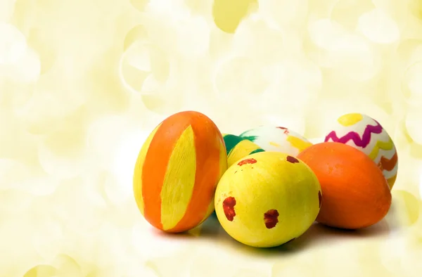 Colored easter eggs on yellow — Stock Photo, Image