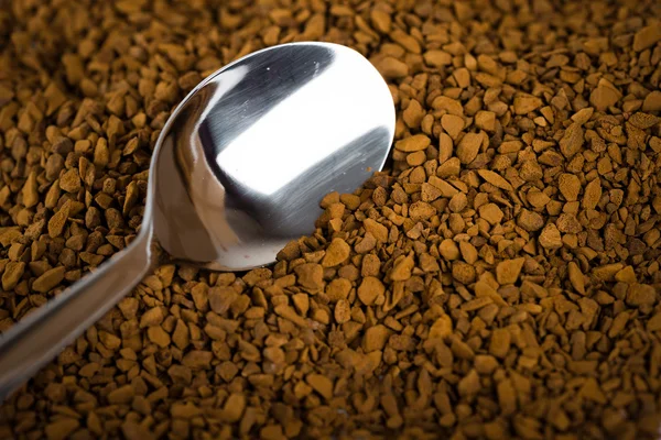 Spoon of coffee at coffe background — Stock Photo, Image