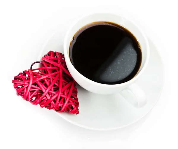 Corazón de paja roja y taza de café — Foto de Stock