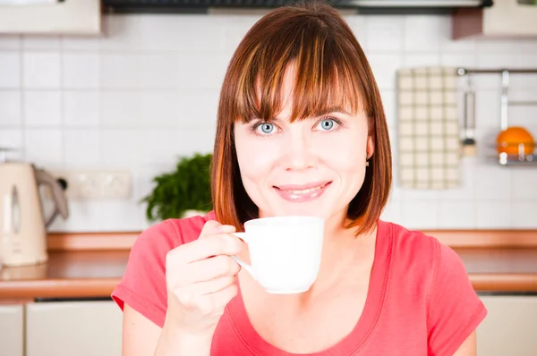 Young woman enjoying a cup of coffee Stock Picture