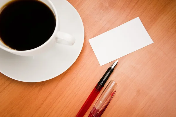 Blank card with pencil on coffee cup with space for your data Royalty Free Stock Images