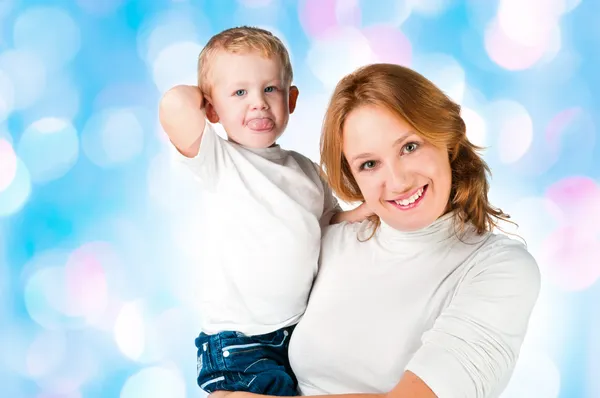 Woman and son sticking Tongues Out — Stock Photo, Image