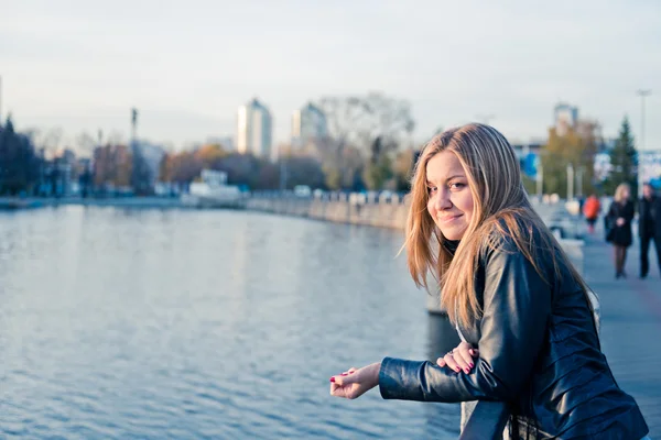 Beautiful woman near fence — Stock Photo, Image